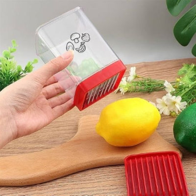 coupe legumes compact avec une couvercle rouge