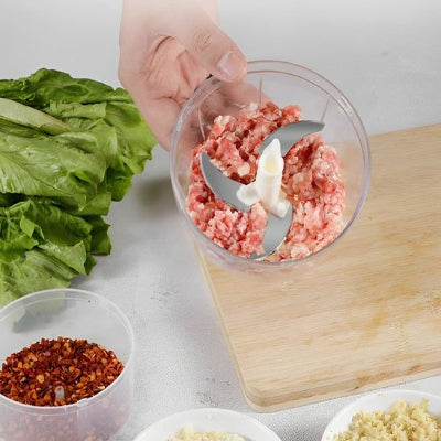 hachoir manuel a tirage avec contenant transparent